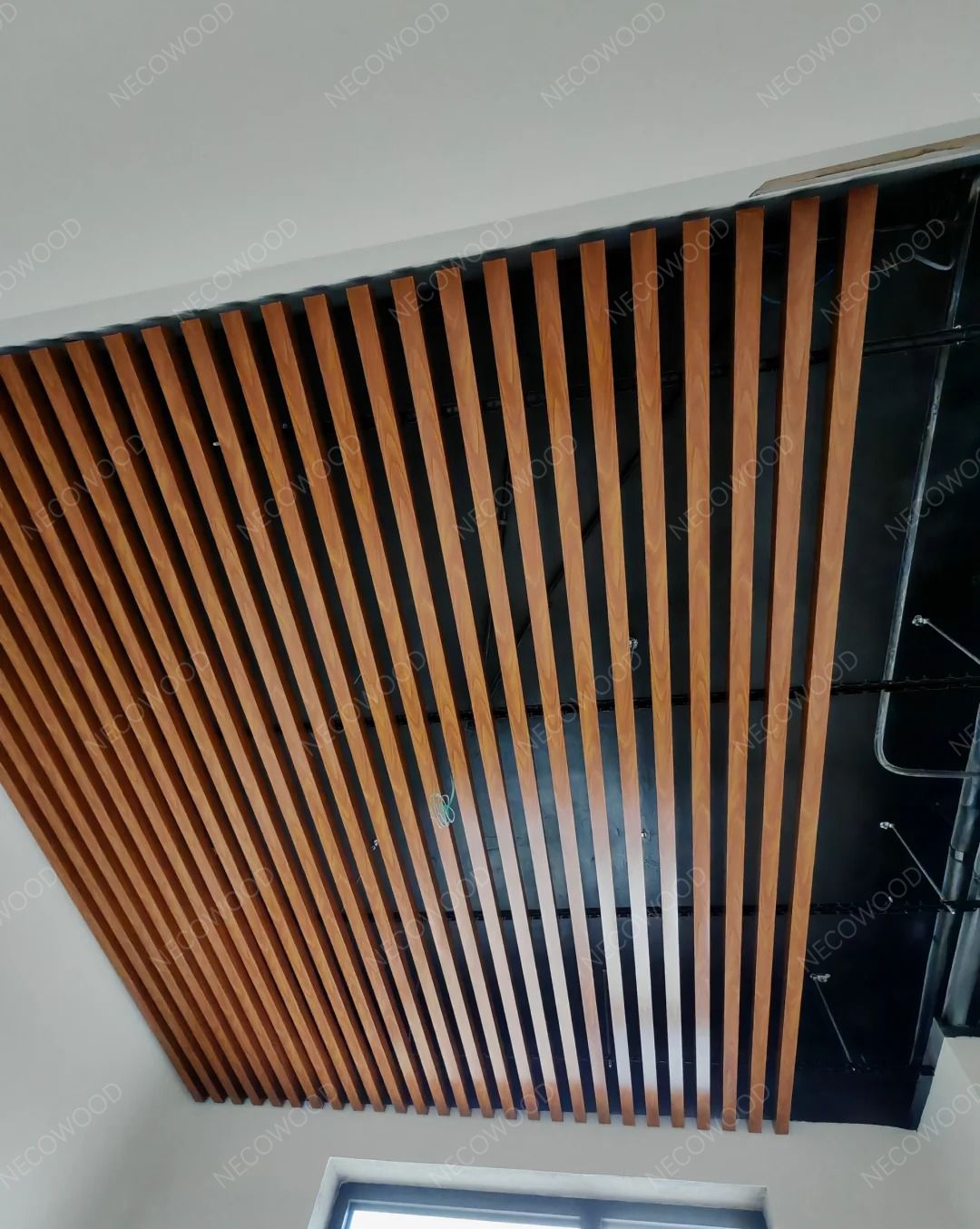 Full view of WPC ceiling in open plan living room, Miami installation